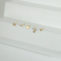 Set of solid gold gold nose studs on a white surface - seolgold