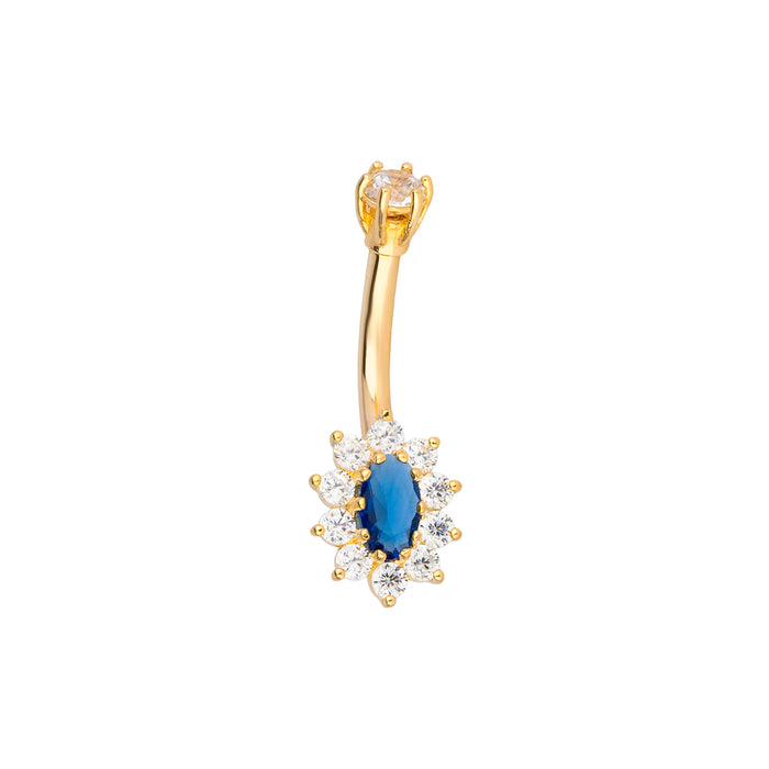 Gold belly button ring with a blue sapphire gemstone and clear stones on a white background - seolgold