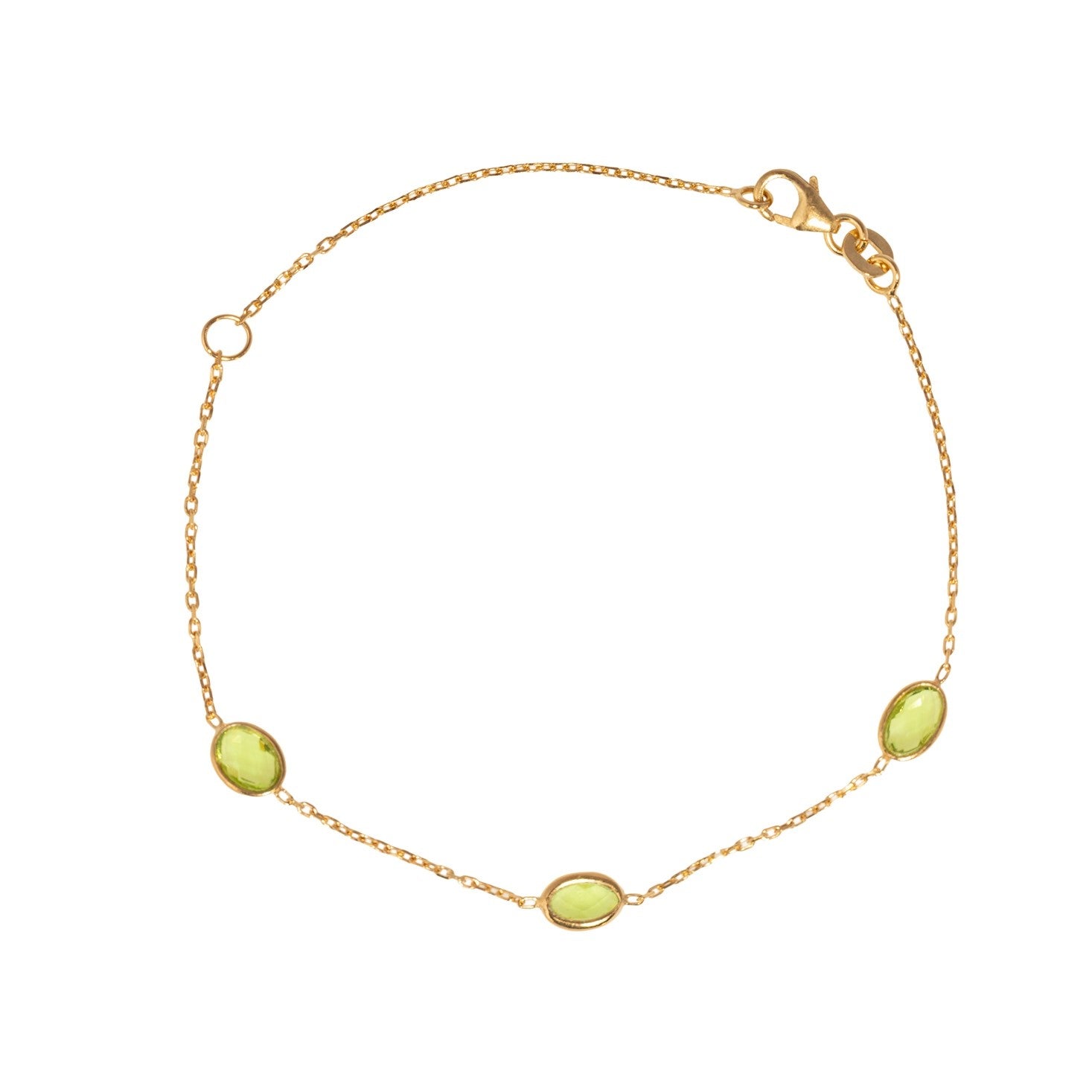 Gold bracelet with green gemstones on a white background - seolgold