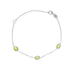 Silver bracelet with three green peridot gemstones on a white background - seolgold