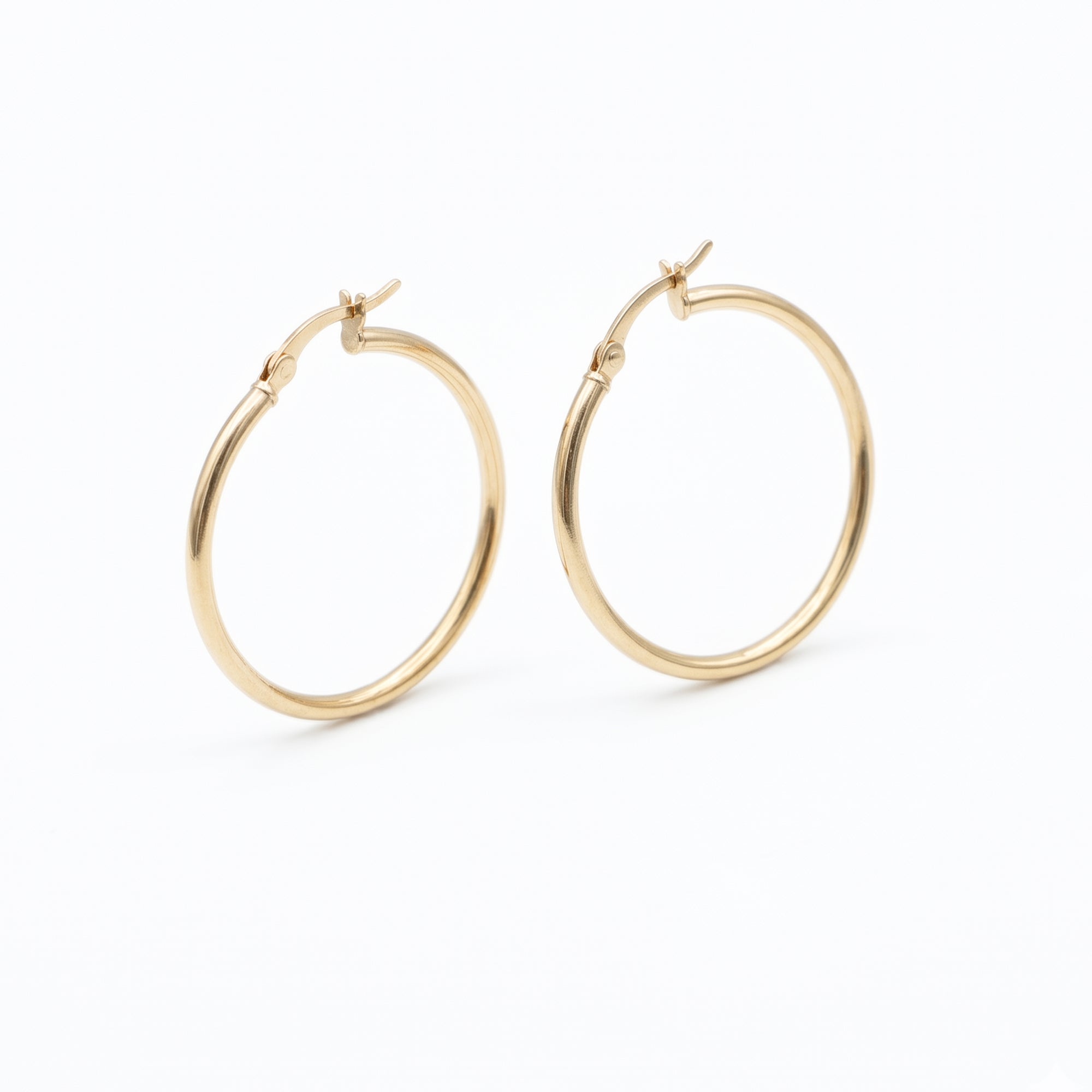 A pair of gold hoop earrings with a classic latch-back clasp, shown on a clean white background - seolgold