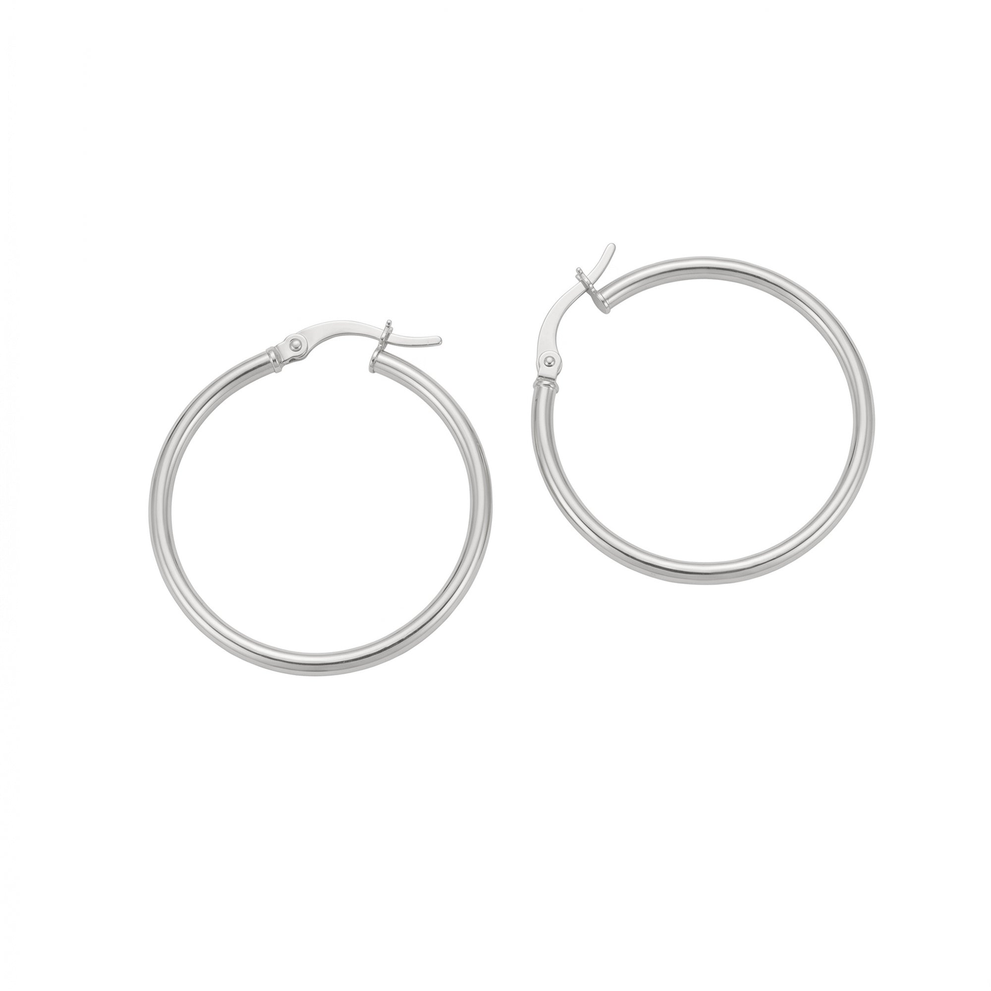 A pair of polished silver hoop earrings with a hinged clasp, displayed on a clean white background - seolgold