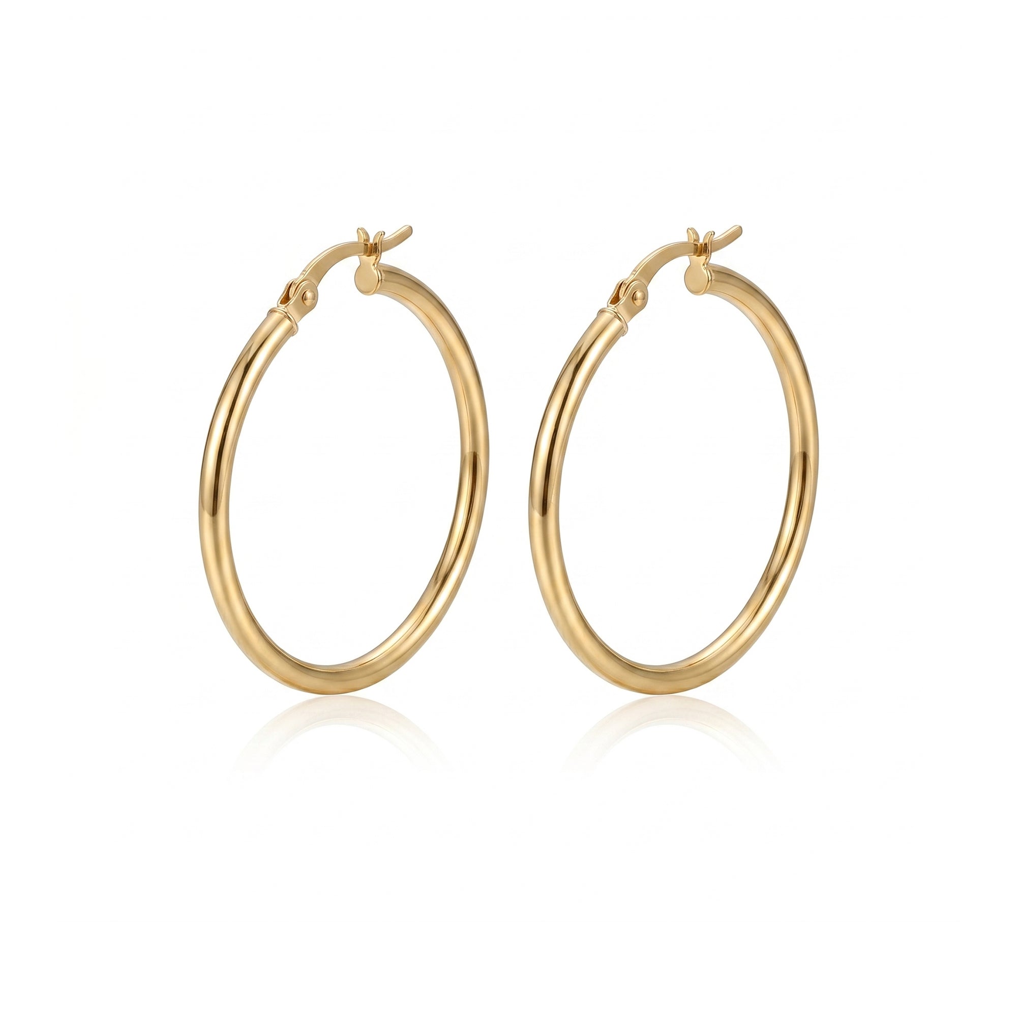 A pair of polished gold hoop earrings with a hinged clasp design, displayed on a clean white background with a soft reflection underneath - seolgold