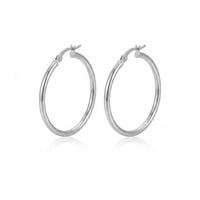 A pair of polished silver hoop earrings with a hinged clasp, displayed on a clean white background with a soft reflection underneath - seolgold