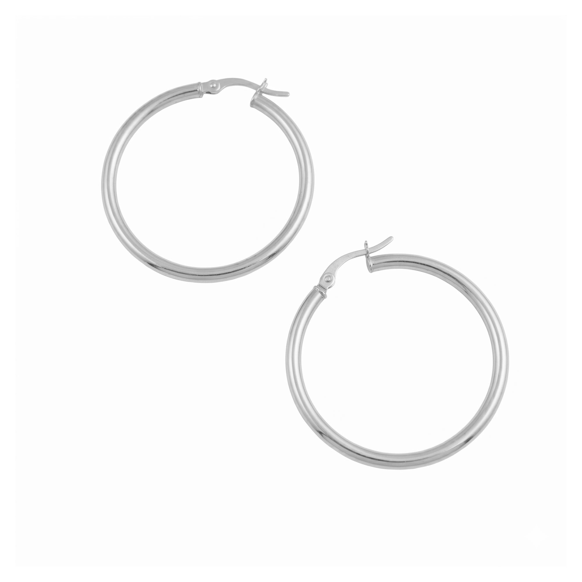 A pair of polished silver hoop earrings with a secure creole clasp, displayed on a clean white background - seolgold