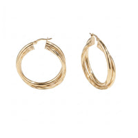 Gold rope twist hoop earrings on a white background - seolgold