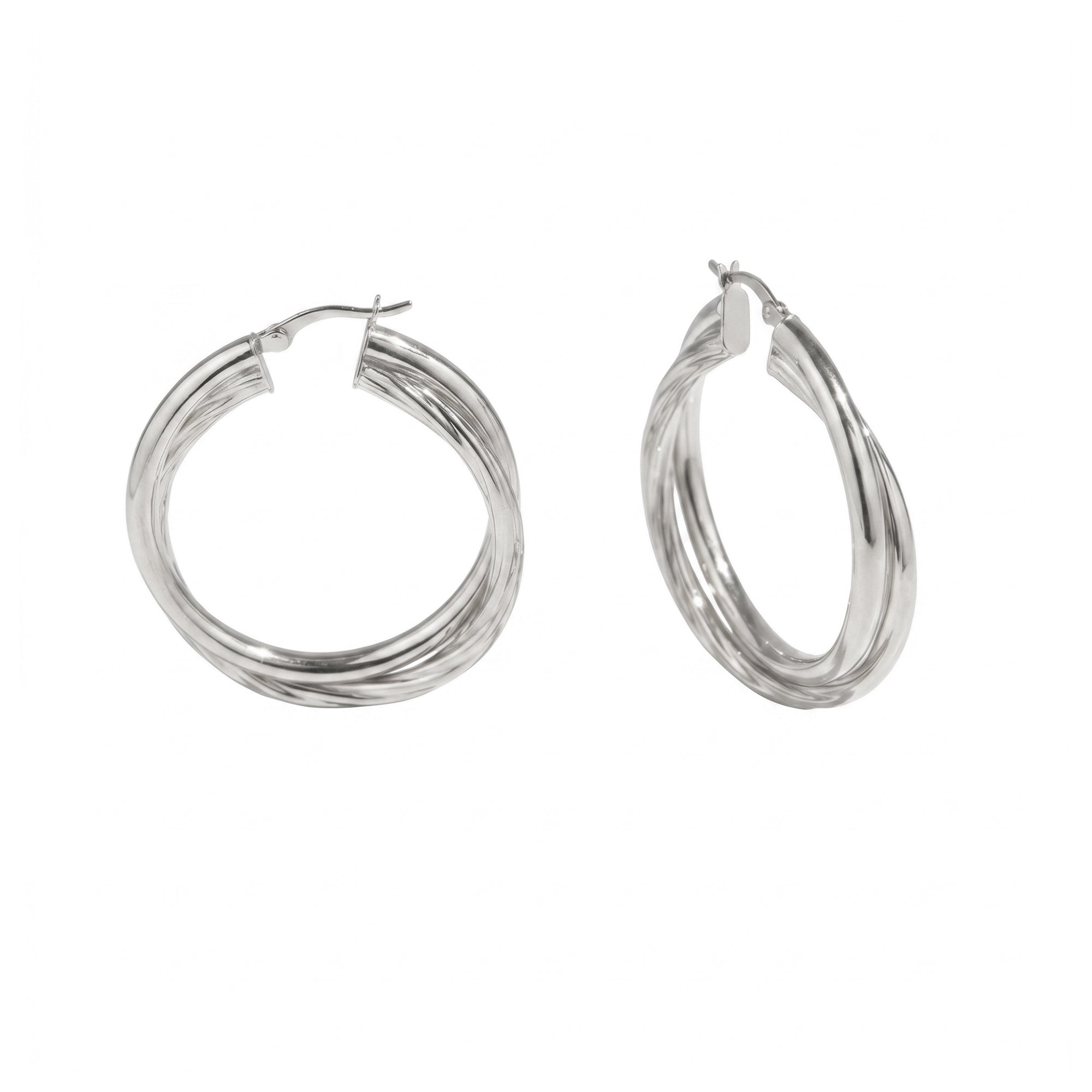 A pair of silver-toned triple-band hoop earrings on a plain white background - seolgold