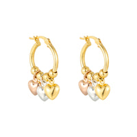 Gold hoop earrings with heart-shaped charms on a white background - Seol Gold