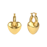 Gold heart-shaped hoop earrings on a white background - seolgold