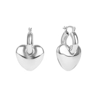 Pair of silver heart-shaped hoop earrings on a white background - seolgold