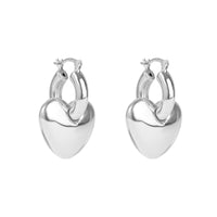 Pair of silver heart-shaped hoop earrings on a white background - seolgold