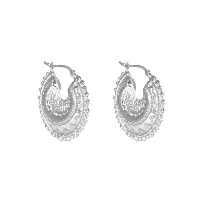 Pair of silver hoop earrings with intricate designs on a white background - seolgold