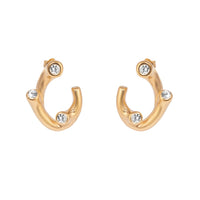 Gold hoop earrings with embedded crystals on a white background - seolgold