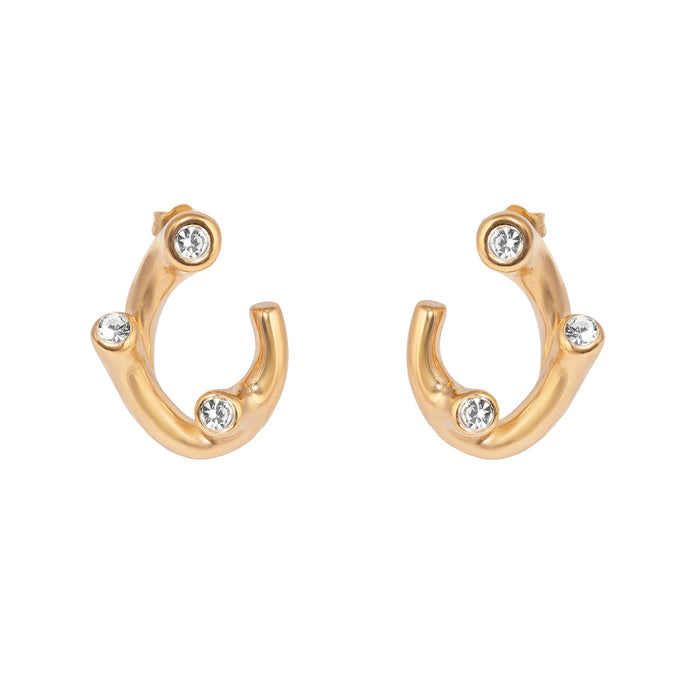 Gold hoop earrings with embedded crystals on a white background - seolgold