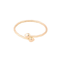 Gold ring with two heart-shaped charms on a white background - seolgold