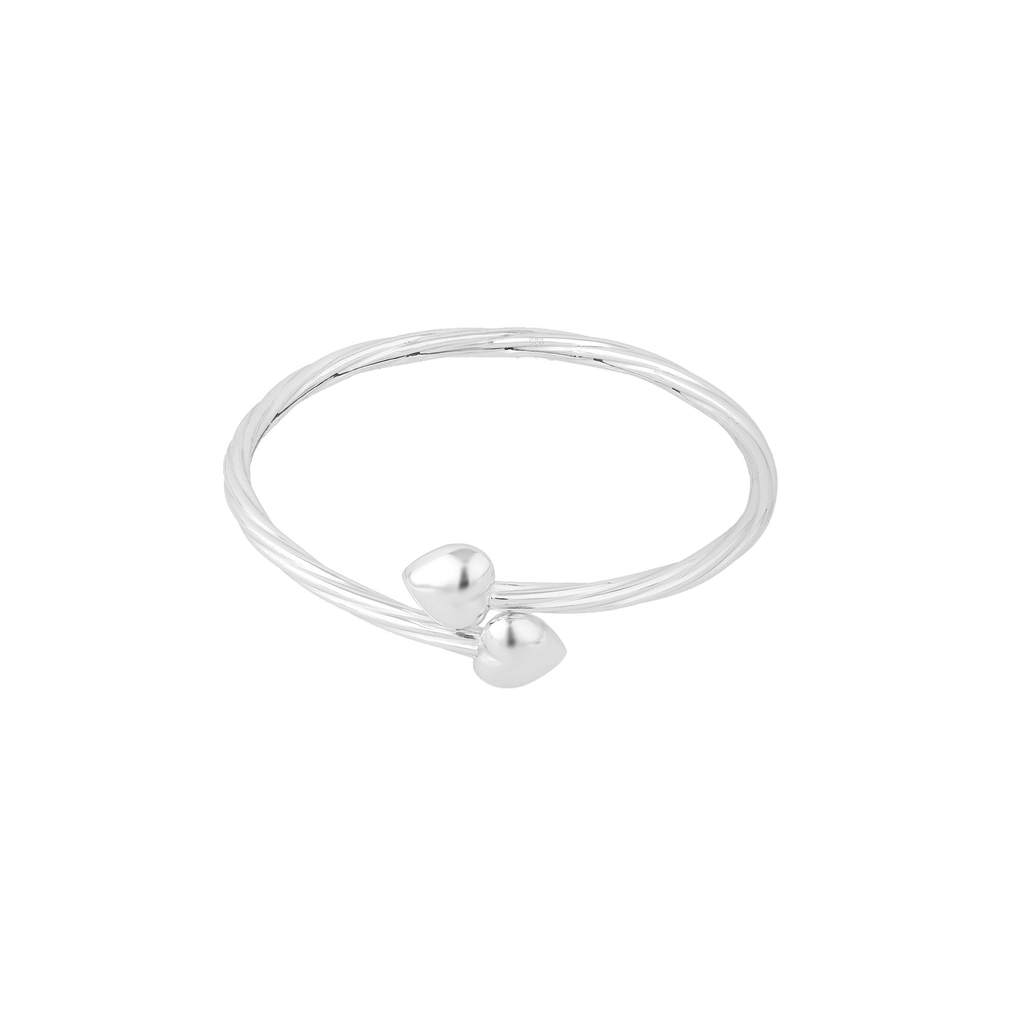 Silver bracelet with two heart-shaped charms on a white background - seolgold