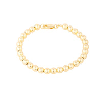 Gold beaded bracelet on a white background - Seol Gold