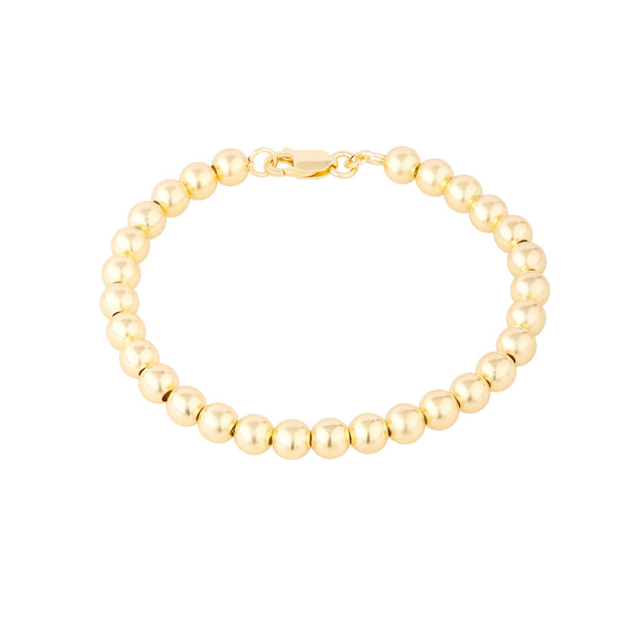 Gold beaded bracelet on a white background - Seol Gold