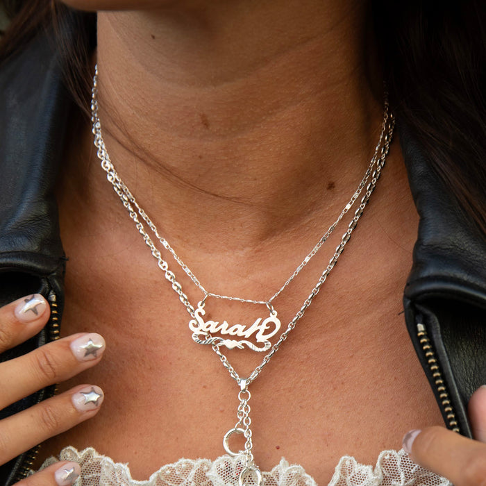 Silver necklace with 'Sarah' pendant worn by a person - vintage name plate - vintage name necklace - seolgold