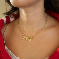 Gold name necklace on a person wearing a red garment -  18ct Gold Vermeil Custom Script Star Name Pendant - seolgold