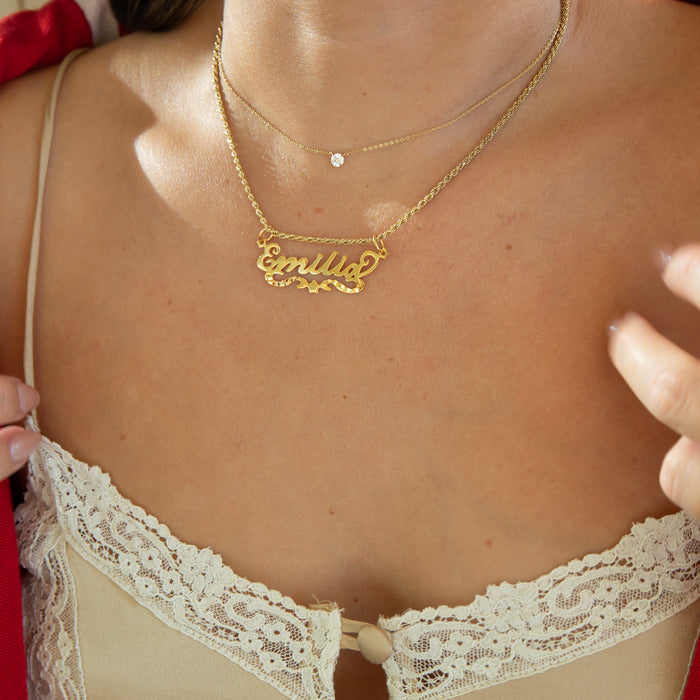 Gold necklace with 'emilia' name pendant on a person wearing a lace vest -  18ct Gold Vermeil Custom Script Star Name Pendant - seolgold