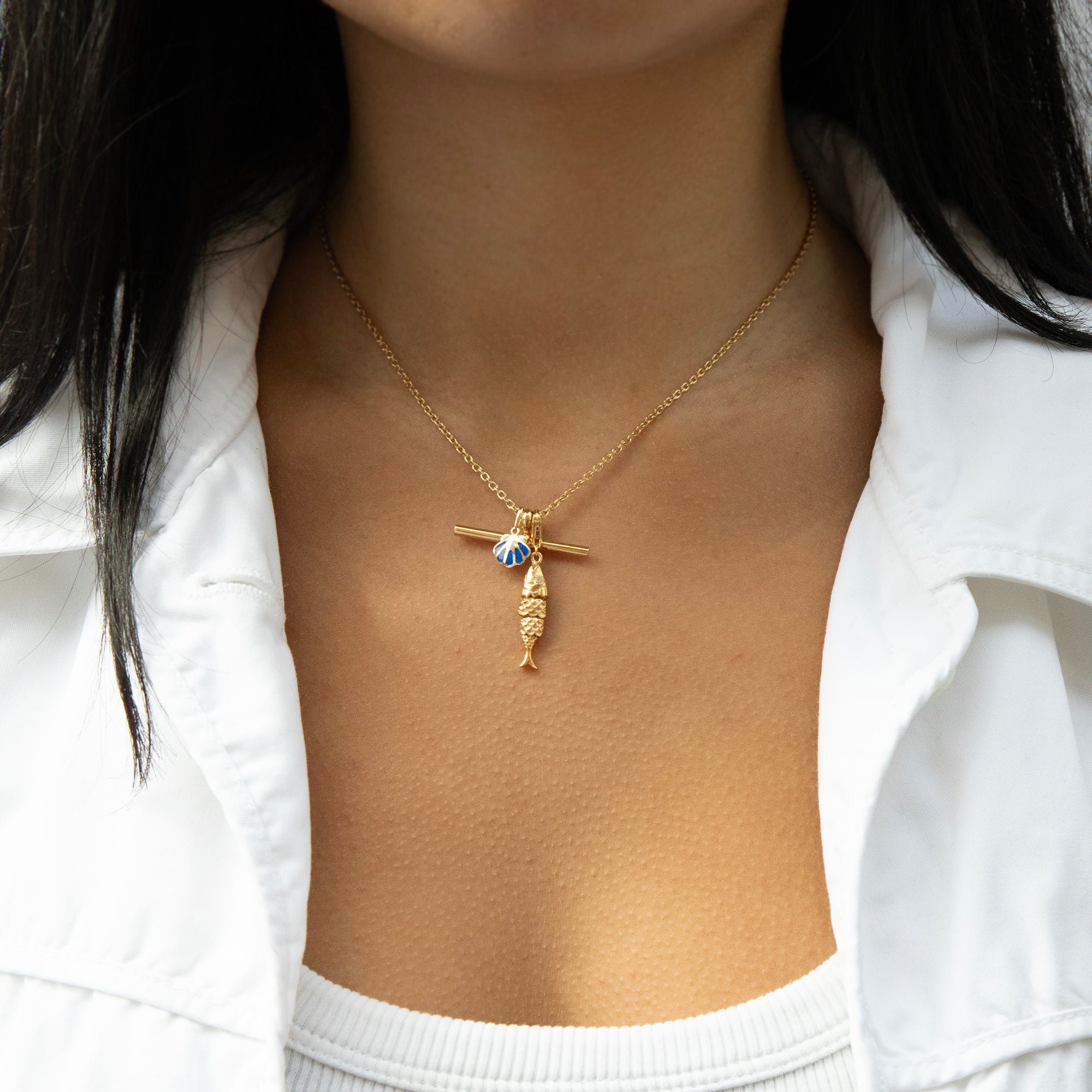 Gold necklace with a pendant worn by a person against a white background - seolgold
