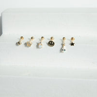 Set of six gold earrings on a white background - seolgold