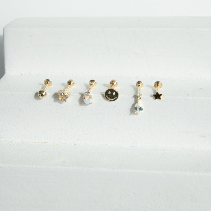 Set of six gold earrings on a white background - seolgold