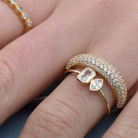 Gold ring with diamond accents on a finger - seolgold