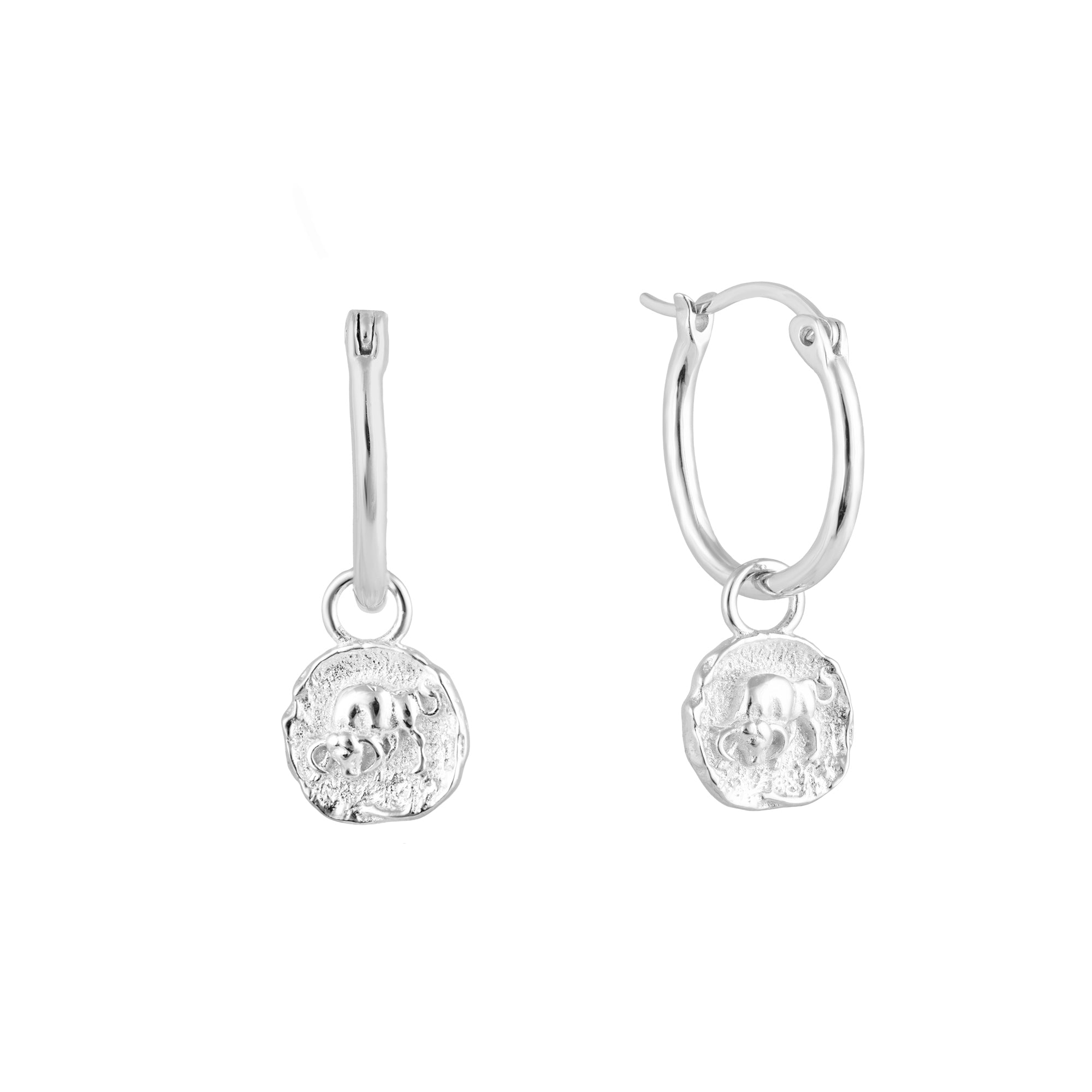 Silver Taurus zodiac charm hoop earrings with round dangling charms on a white background - seolgold
