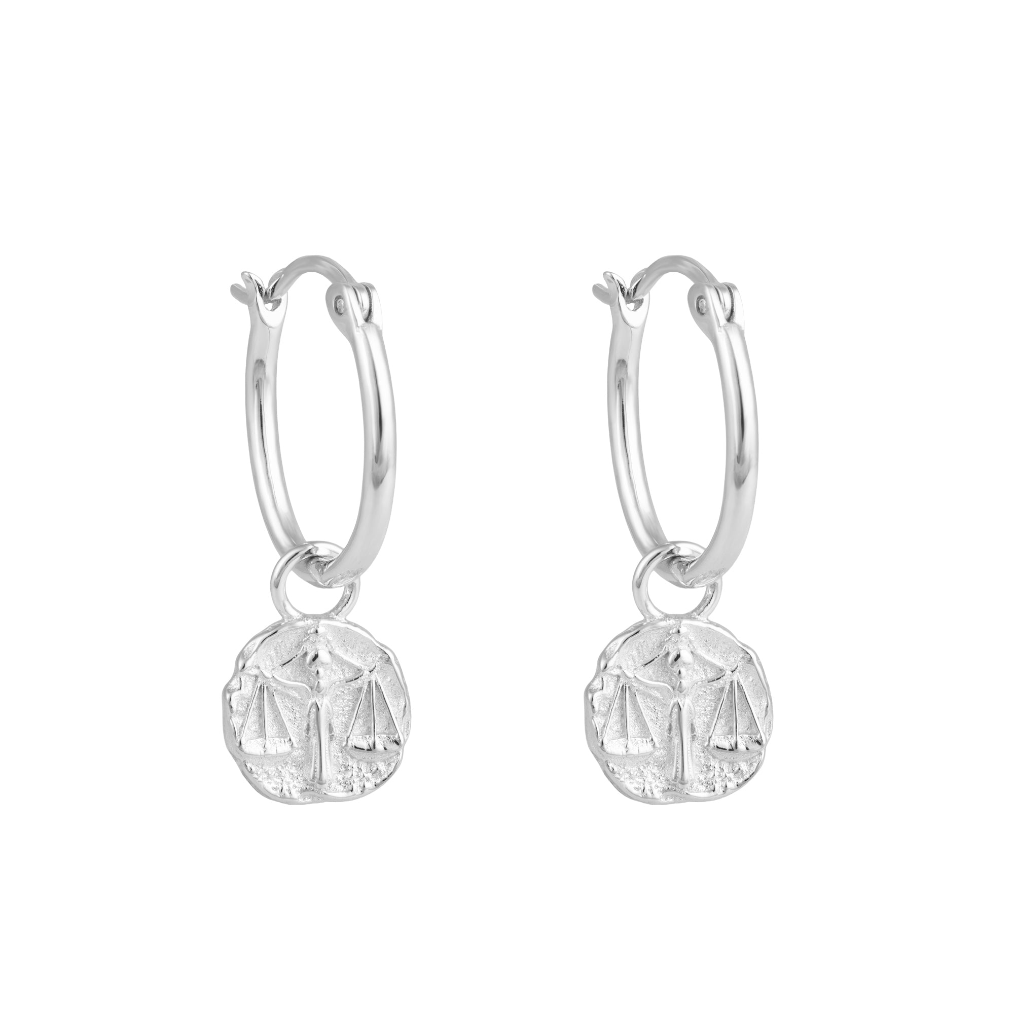 Silver Libra zodiac charm hoop earrings with round dangling charms on a white background - seolgold