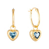 Gold heart-shaped earrings with blue gemstones on a white background - seolgold