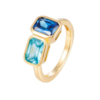 Gold ring with blue gemstones on a white background - seolgold