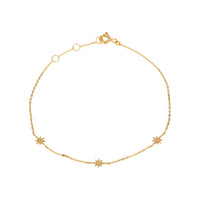 Gold bracelet with star-shaped charms on a white background - seolgold