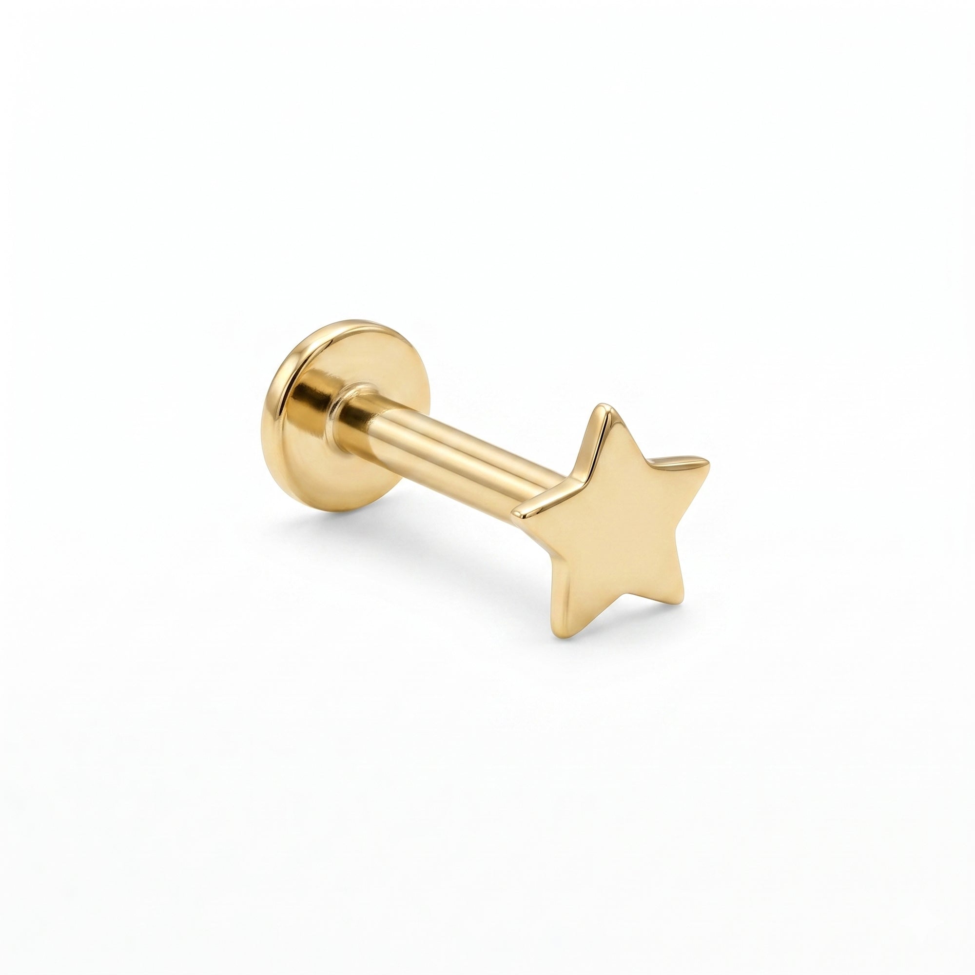 Gold star-shaped tiny cartilage earring on a white background - seolgold