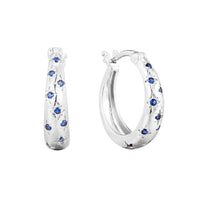 Silver hoop earrings with blue gemstones on a white background - seolgold