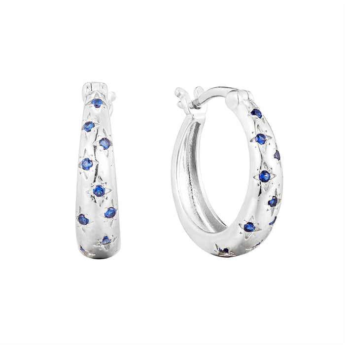 Silver hoop earrings with blue gemstones on a white background - seolgold