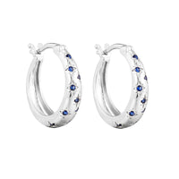 Silver hoop earrings with blue gemstones on a white background - seolgold
