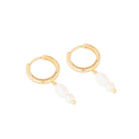 Gold hoop earrings with white beads on a white background - seolgold