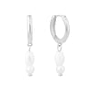 Silver hoop earrings with white pearl charms on a white background - seolgold