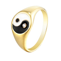 Gold ring with a black and white design on a white background - seolgold