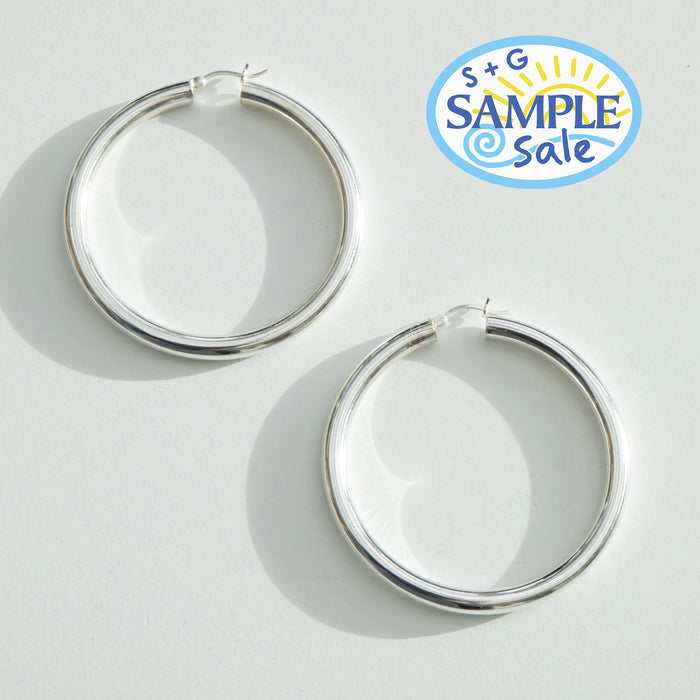 Silver hoop earrings on a light gray background with 'S+G Sample Sale' logo - seolgold