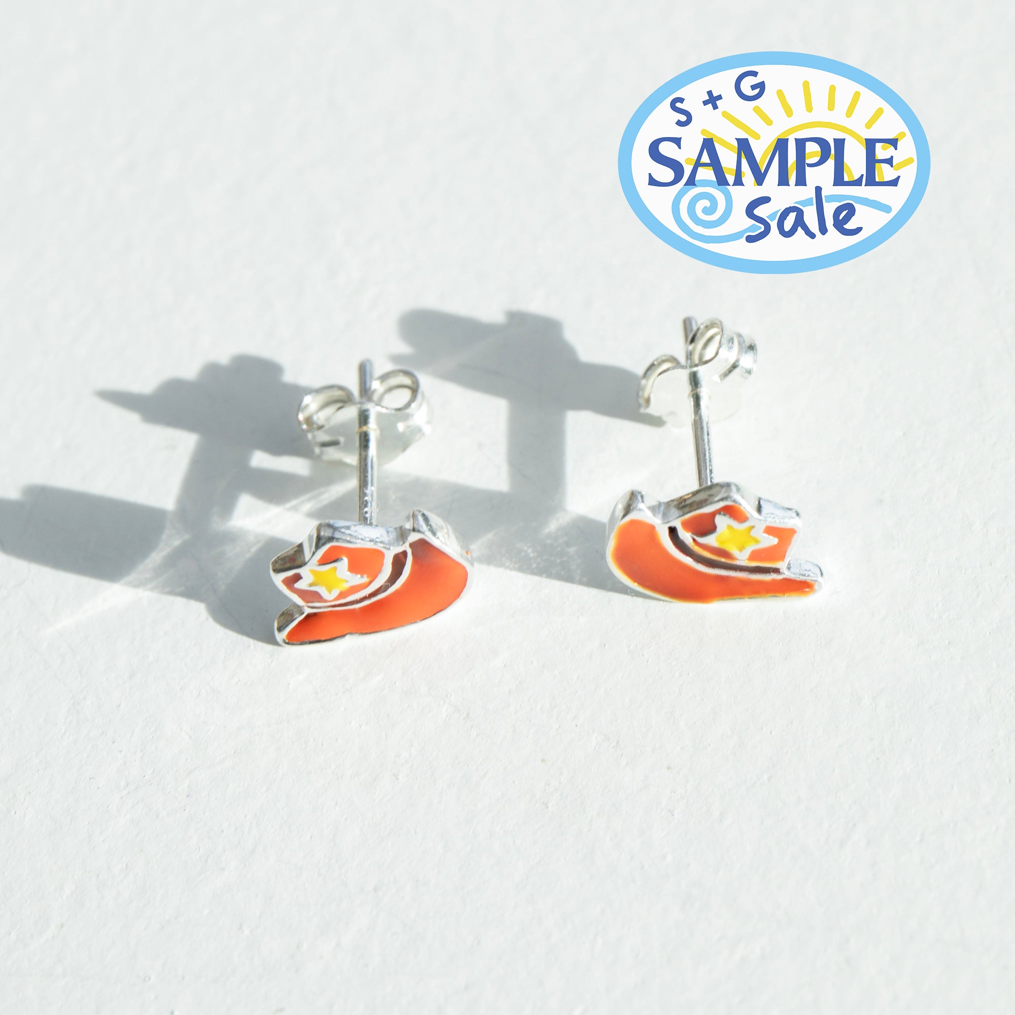 cowboy boot stud earrings background, featuring a 'S+G Sample Sale' logo - seolgold