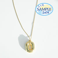 Gold necklace with a pendant on a white background, featuring 'S+G Sample Sale' logo - seolgold