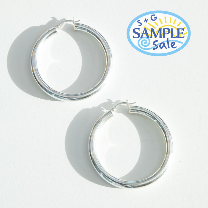 Silver hoop earrings on a white background with 'S+G Sample Sale' logo - seolgold