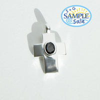 Silver pendant with a black gemstone on a white background, featuring 'S+G Sample Sale' logo.