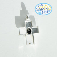 Silver cross pendant with a black gemstone on a white background with 'S+G Sample Sale' logo.