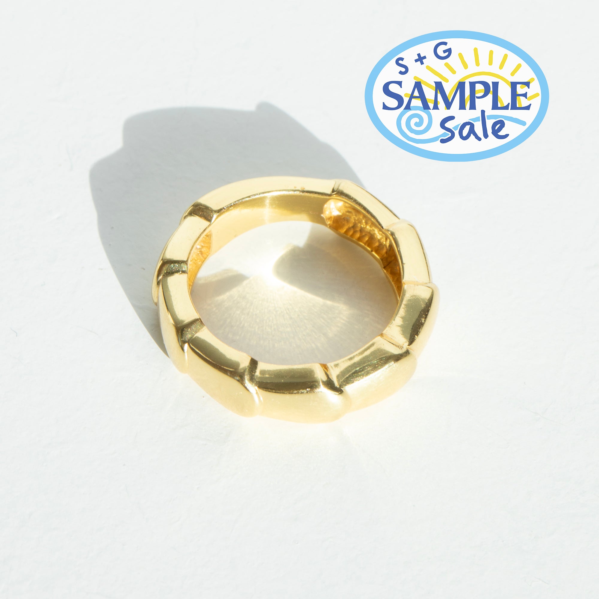 Gold ring on a white background with 'S+G Sample Sale' logo.
