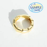 Gold ring  on a light gray background, featuring S+G Sample Sale logo.