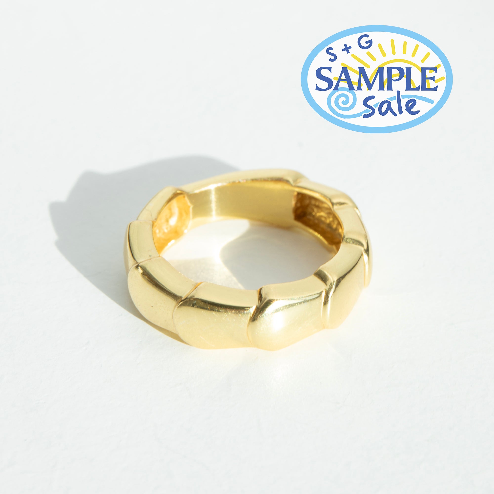 Gold ring on a white background with 'S+G Sample Sale' logo.